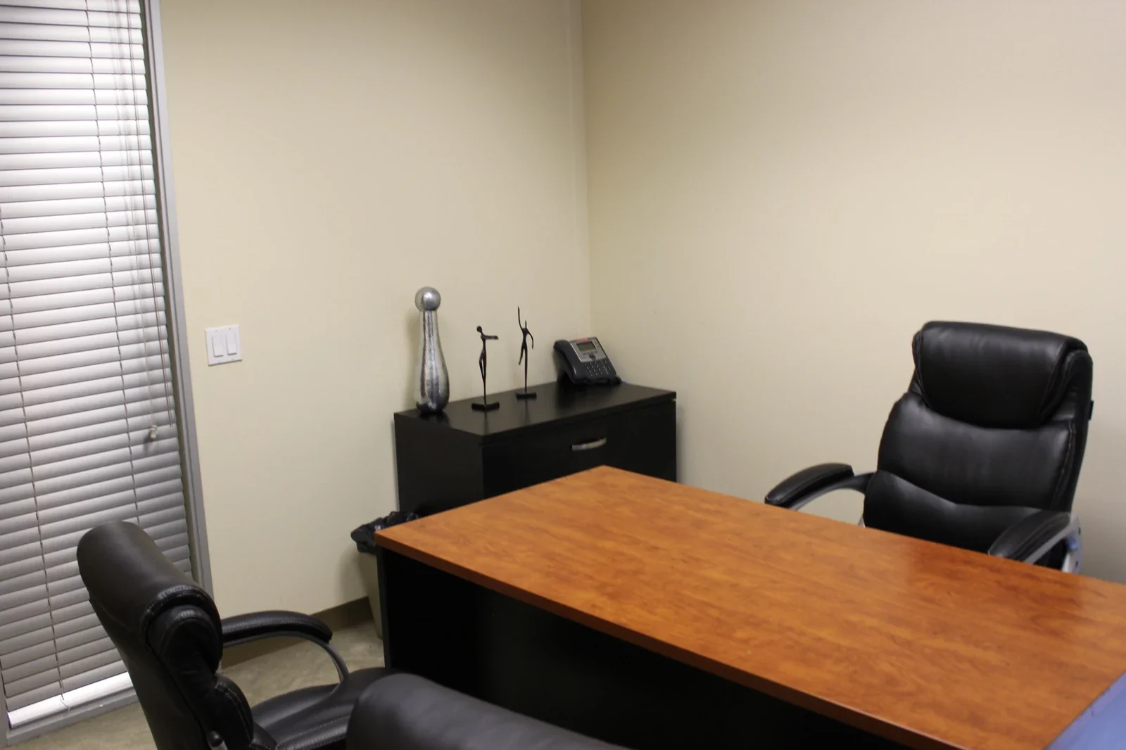 Day Office desk with an executive chair and cabinet.